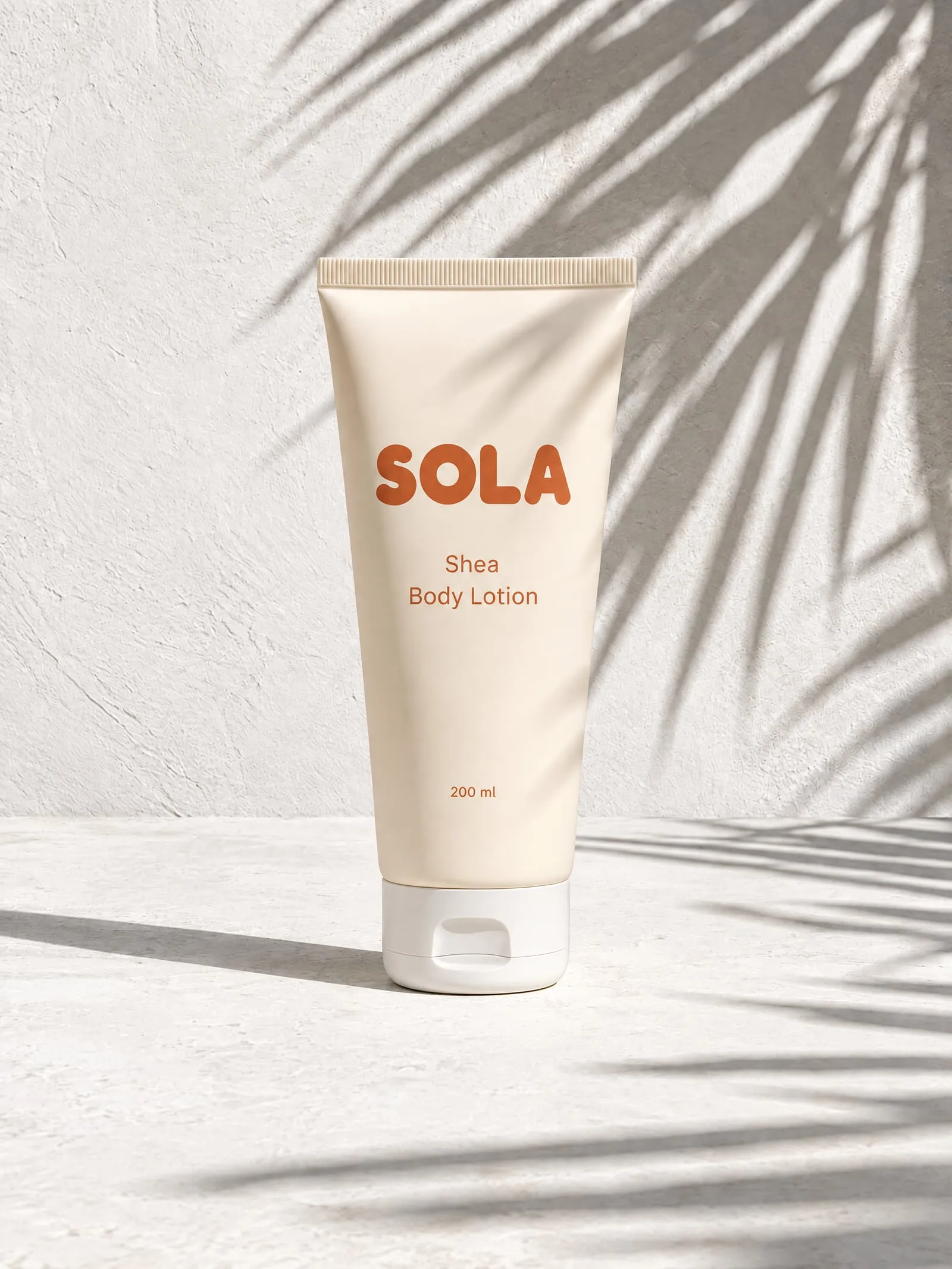 The SOLA shea body lotion, front view, in hard sun and leaf shadows