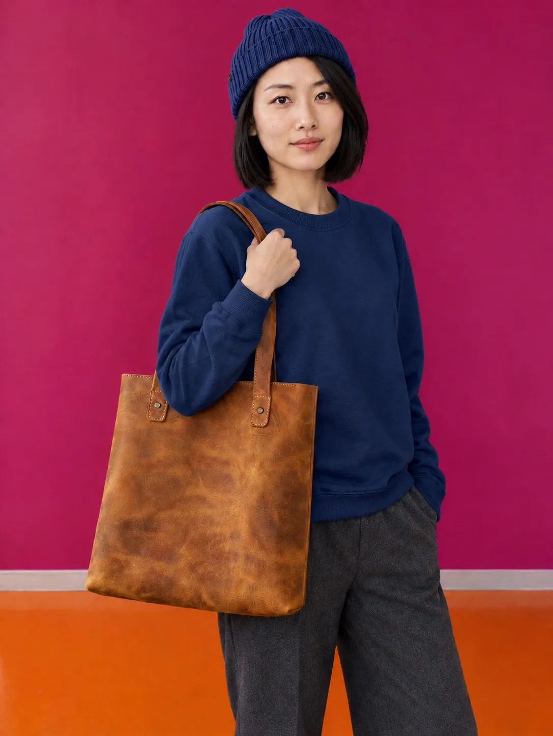 The same photo with the sweater and beanie turned navy blue